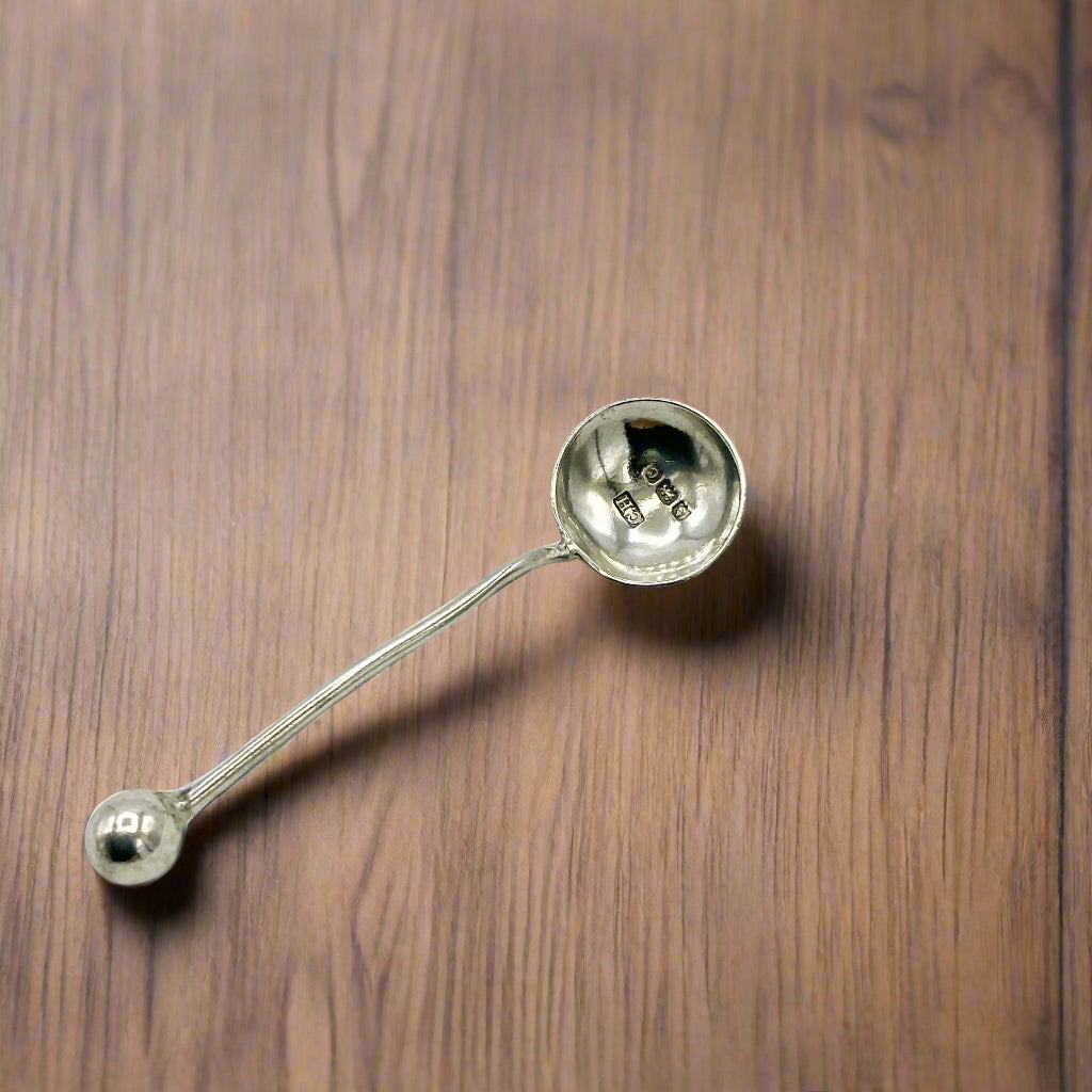 Silver spoon on a wooden table