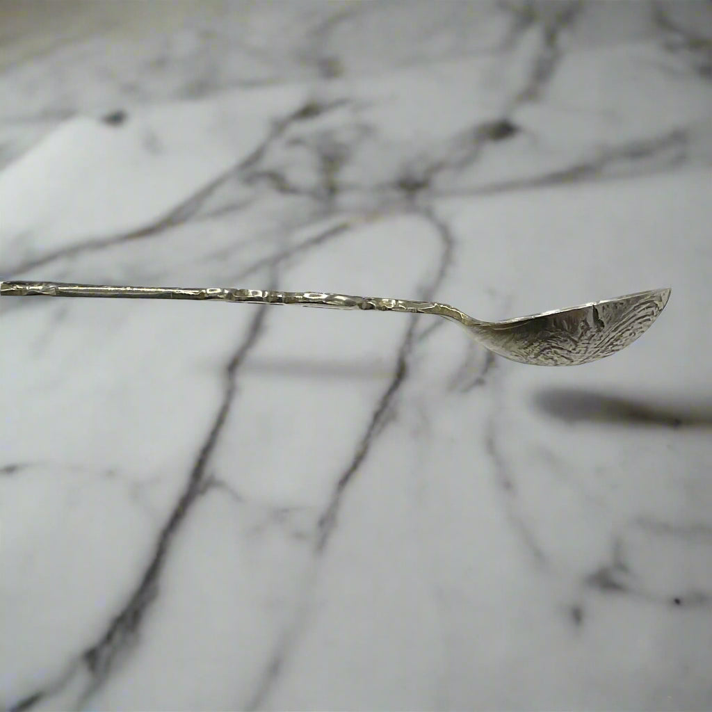 Silver spoon on a marble surface