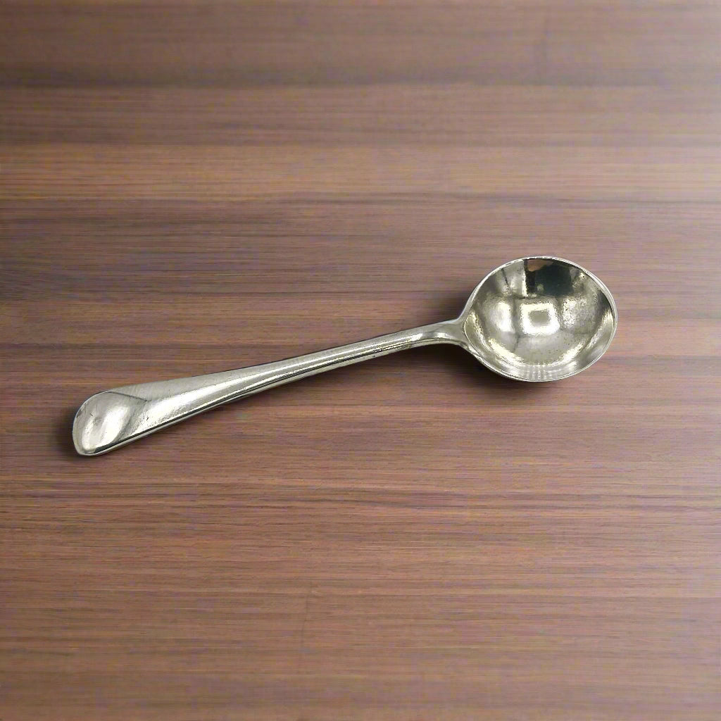 Silver spoon on a wood table