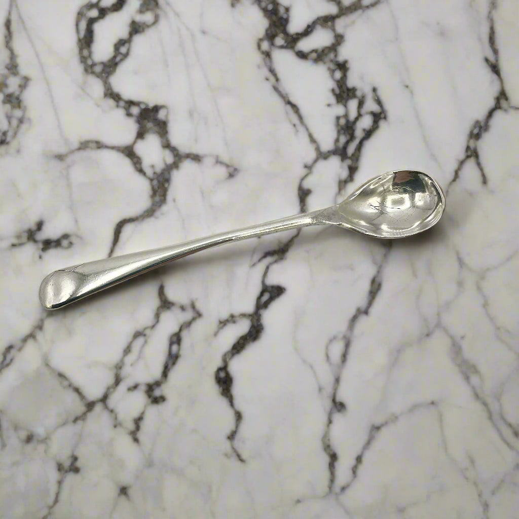 Silver spoon on a marble top