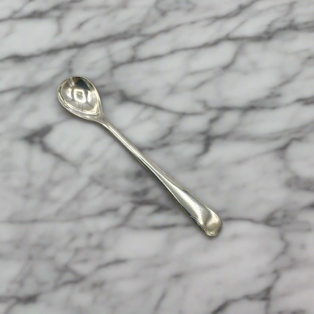 Silver spoon on a marble worktop