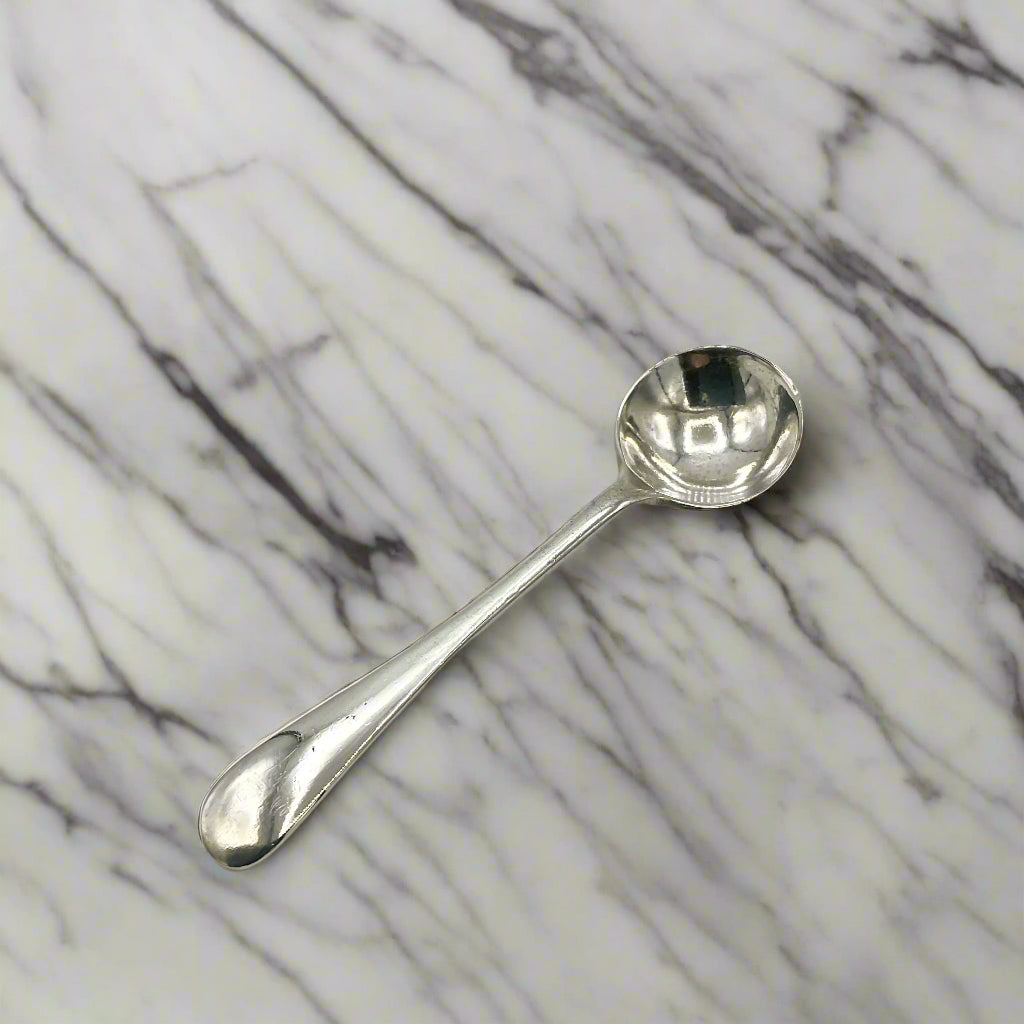Silver spoon on a marble worktop