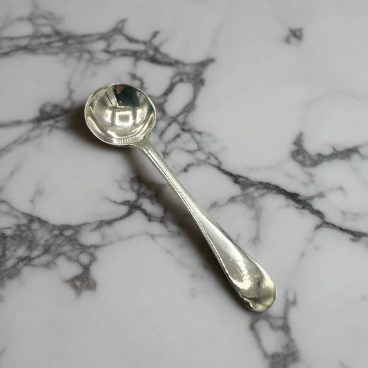 Silver spoon on a marble background