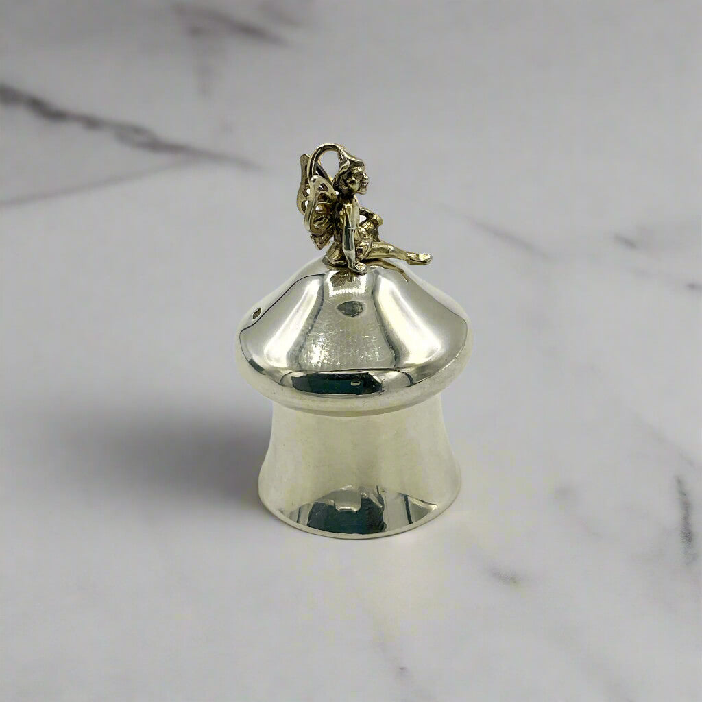Silver pill box on a marble surface