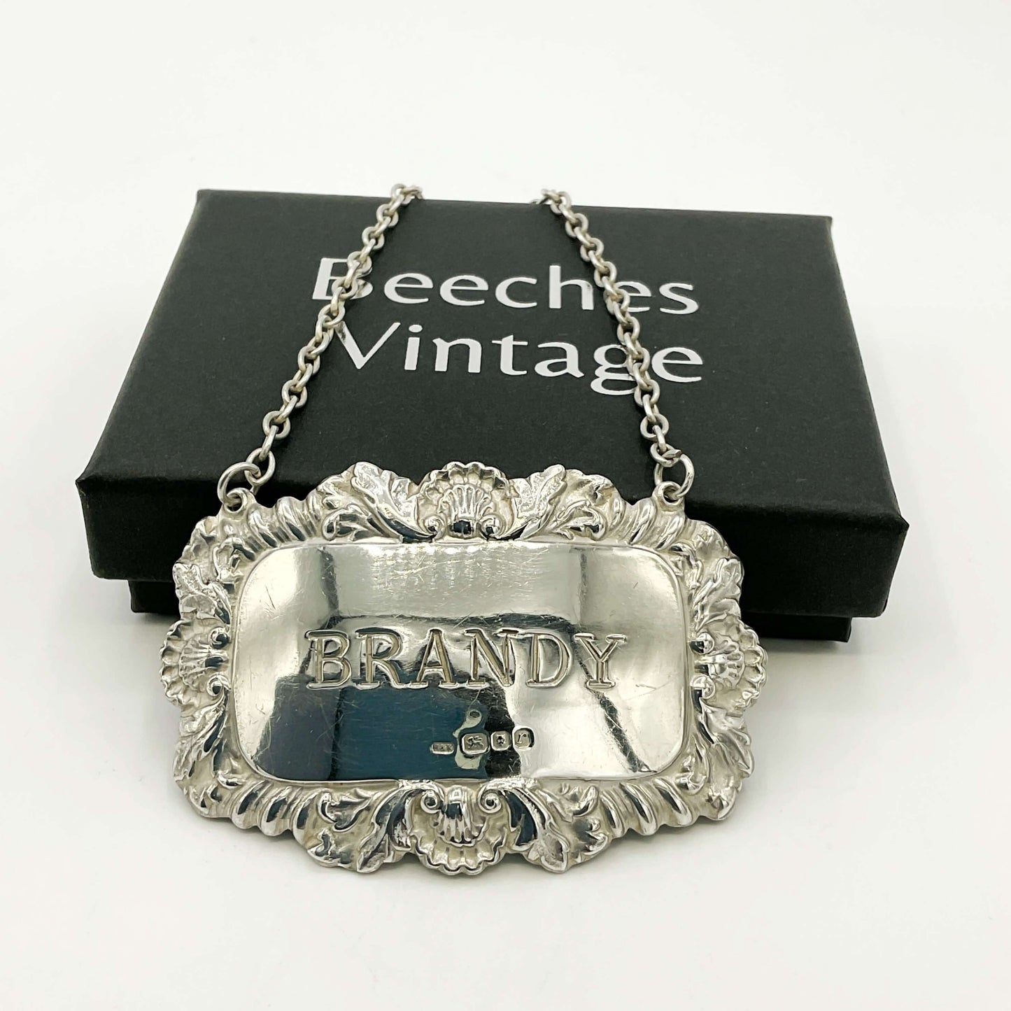 Silver brandy decanter label on a white background with 'Beeches Vintage' packaging and a white background.