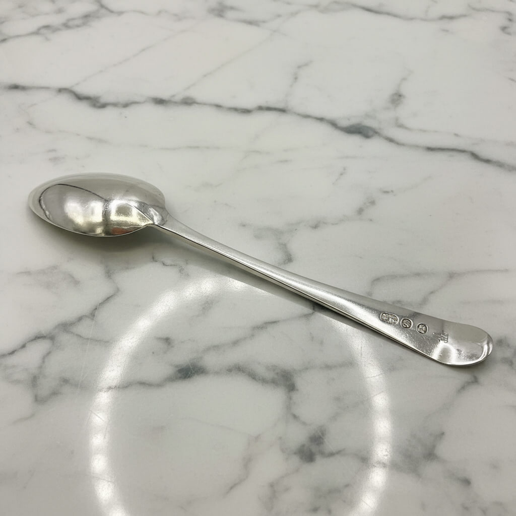 Silver spoon on a marble surface