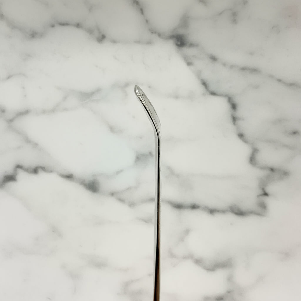 Silver spoon on a marble surface