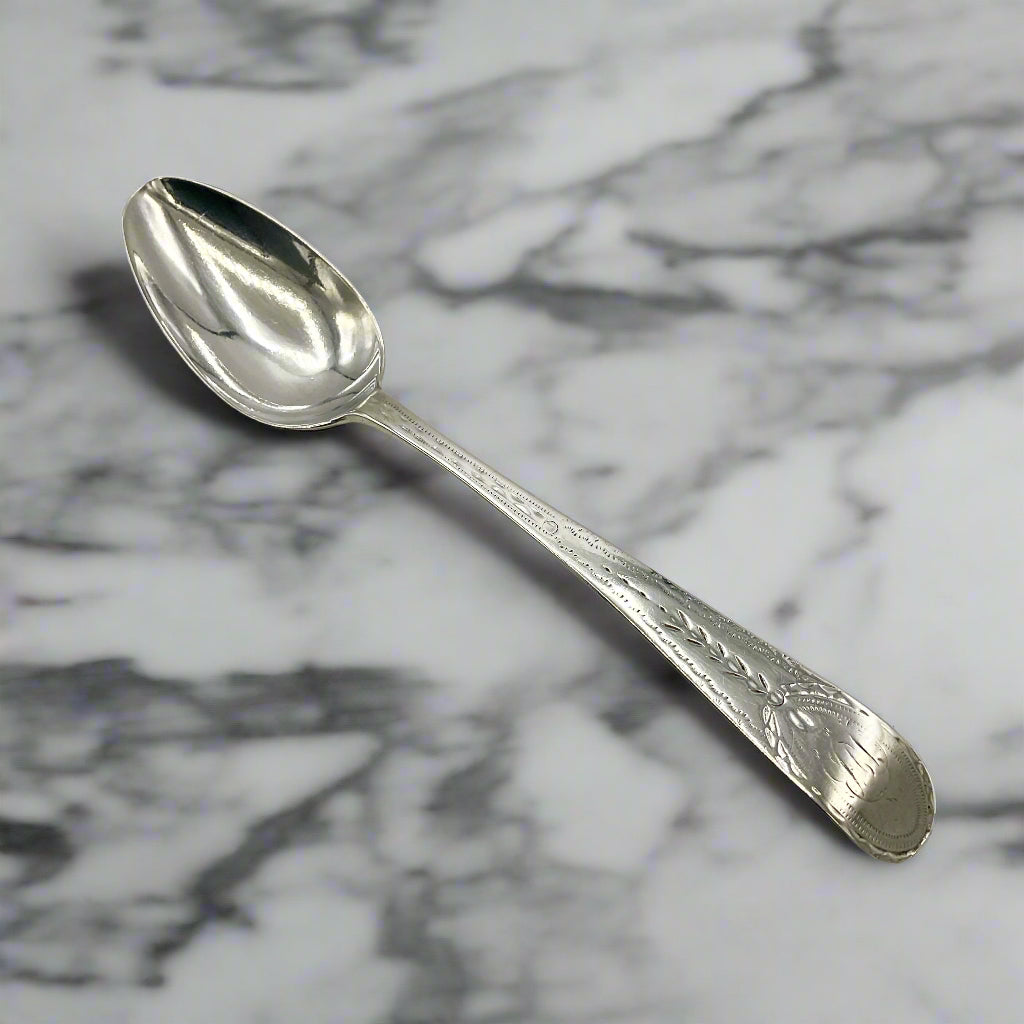 Silver spoon on a marble surface