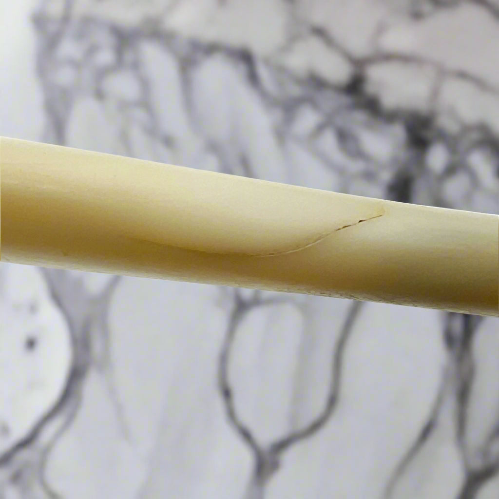 Close-up of a crack on pearl handle 