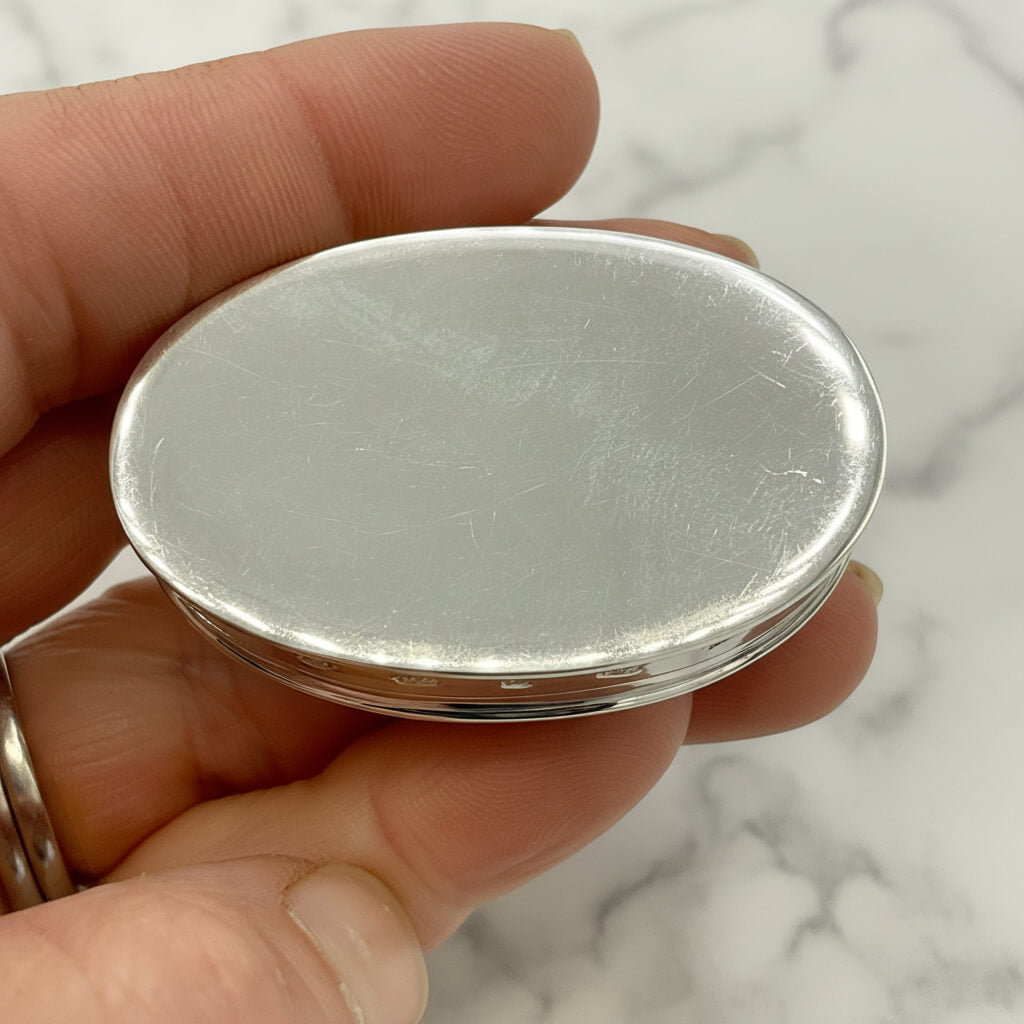 Large Rose Sterling Silver Pill Box base held in a hand with a marble background