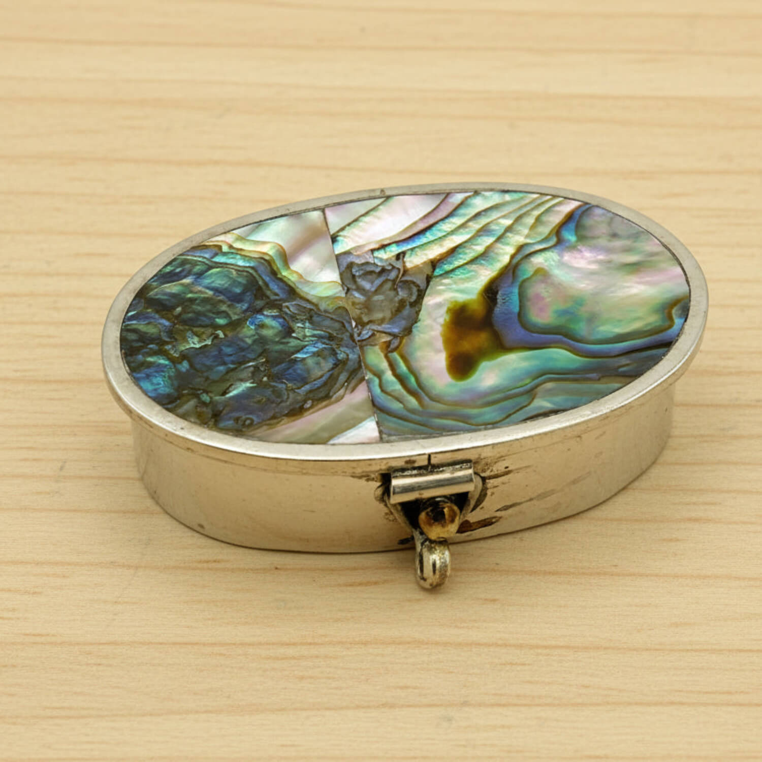 Mexican Abalone Shell Pill Box on a wood table
