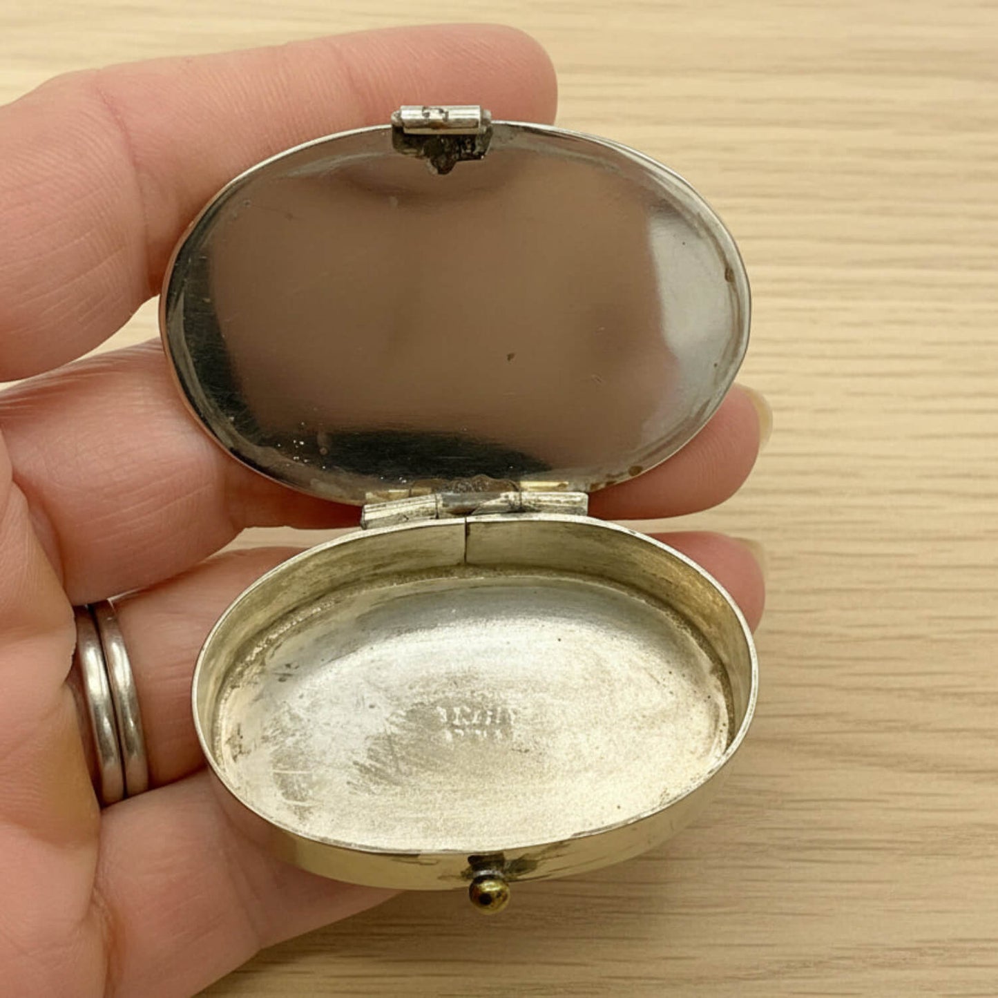 Mexican Abalone Shell Pill Box inside view held in hand