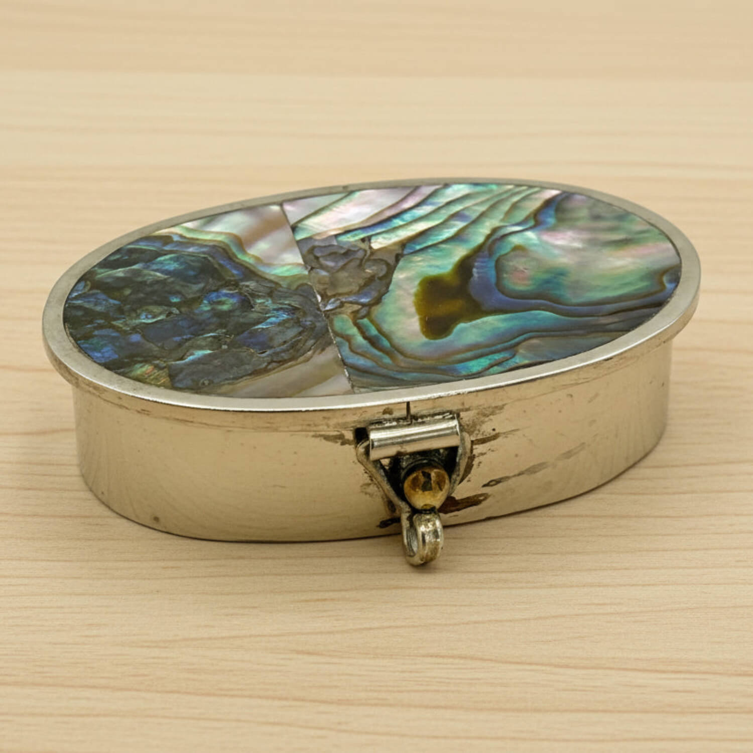 Mexican Abalone Shell Pill Box on a wood table