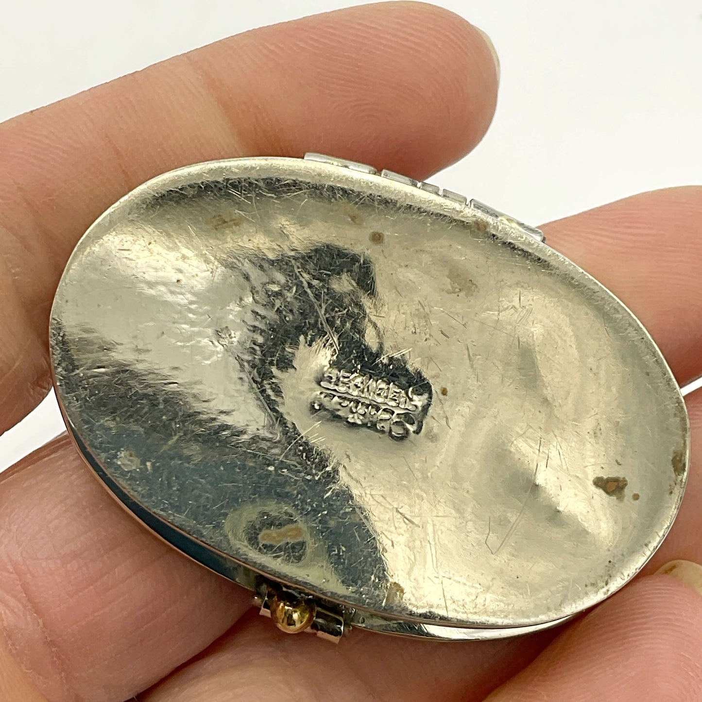 base view of Mexican Abalone Shell Pill Box held in hand