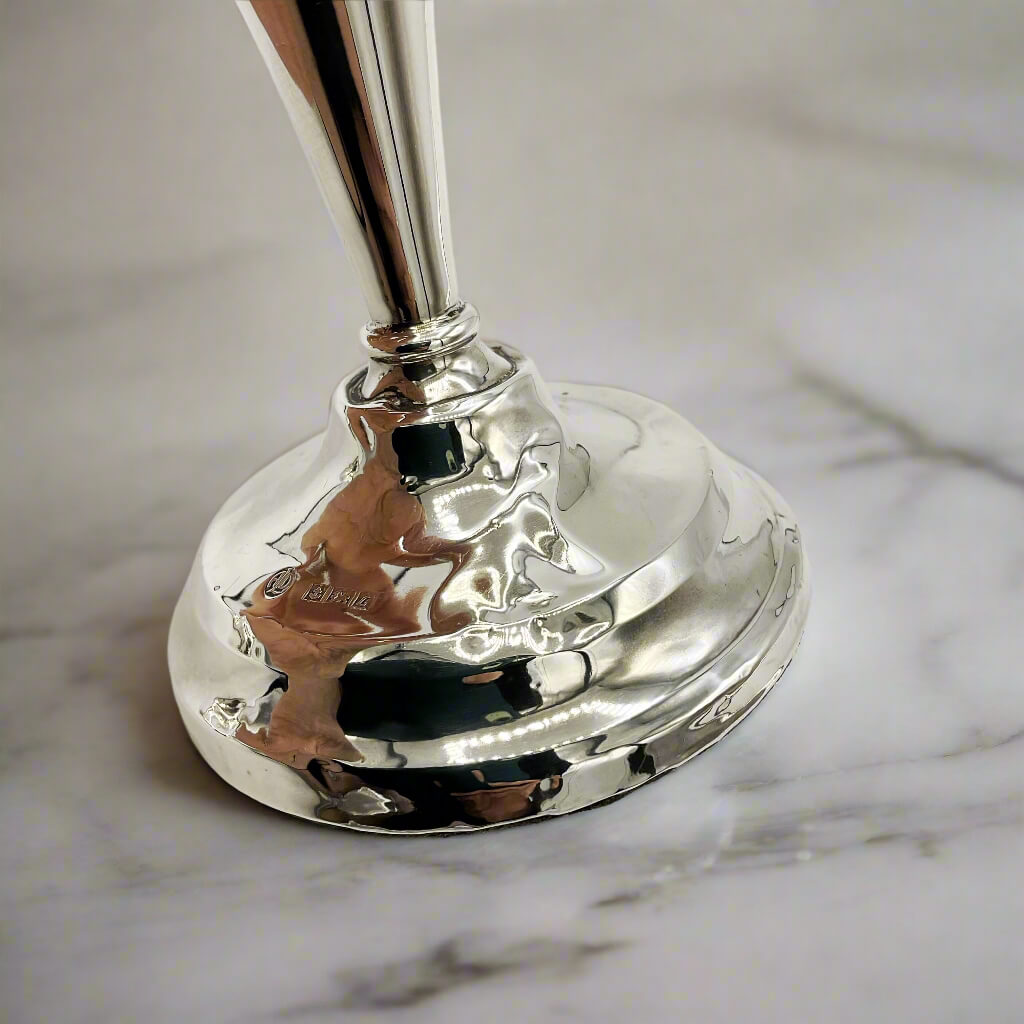 Silver bell on a marble surface