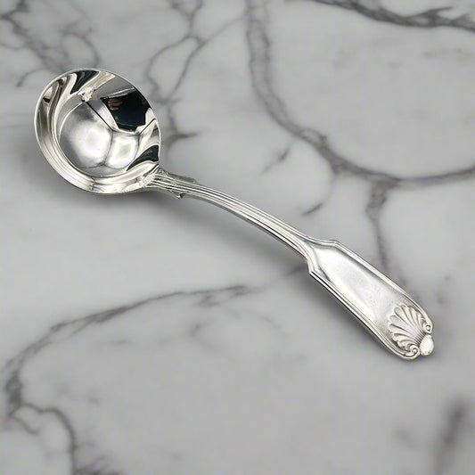 Small Silver Plated Sauce Ladle on a marble worktop