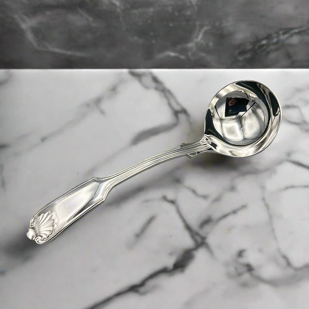 Silver ladle on a marble surface