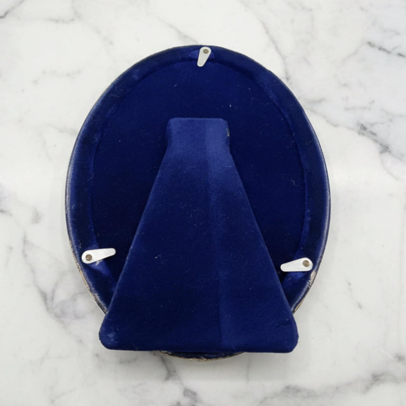 back of Sterling Silver Oval Photo Frame on a marble worktop