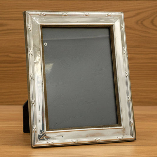 Silver picture frame on a wooden surface