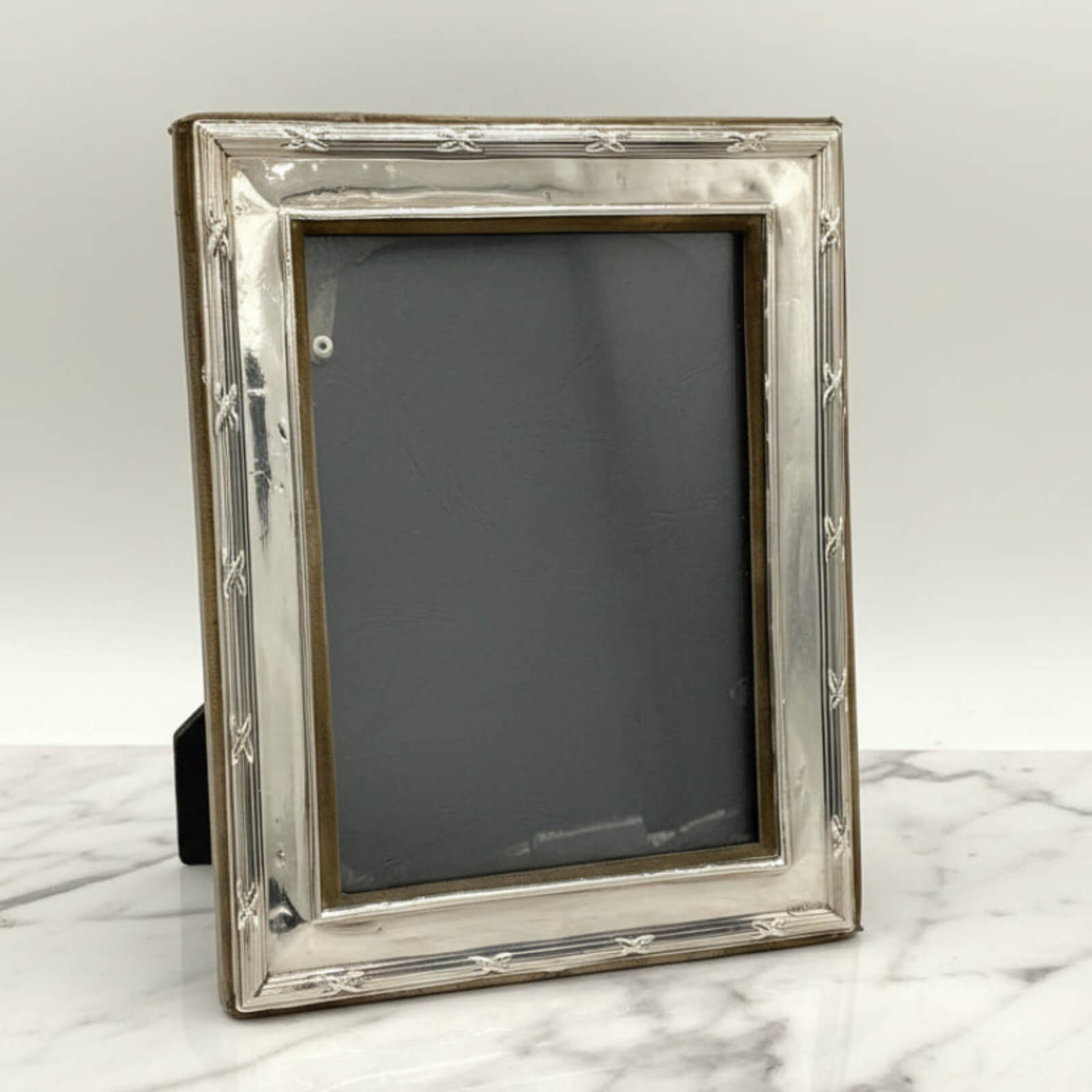 Sterling Silver Rectangular Photo Frame on a marble surface