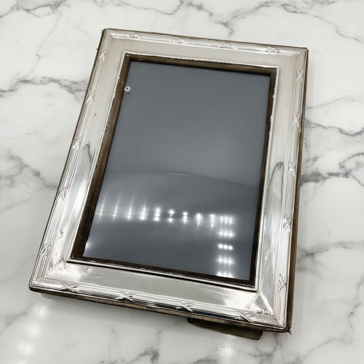 Silver picture frame on a marble surface