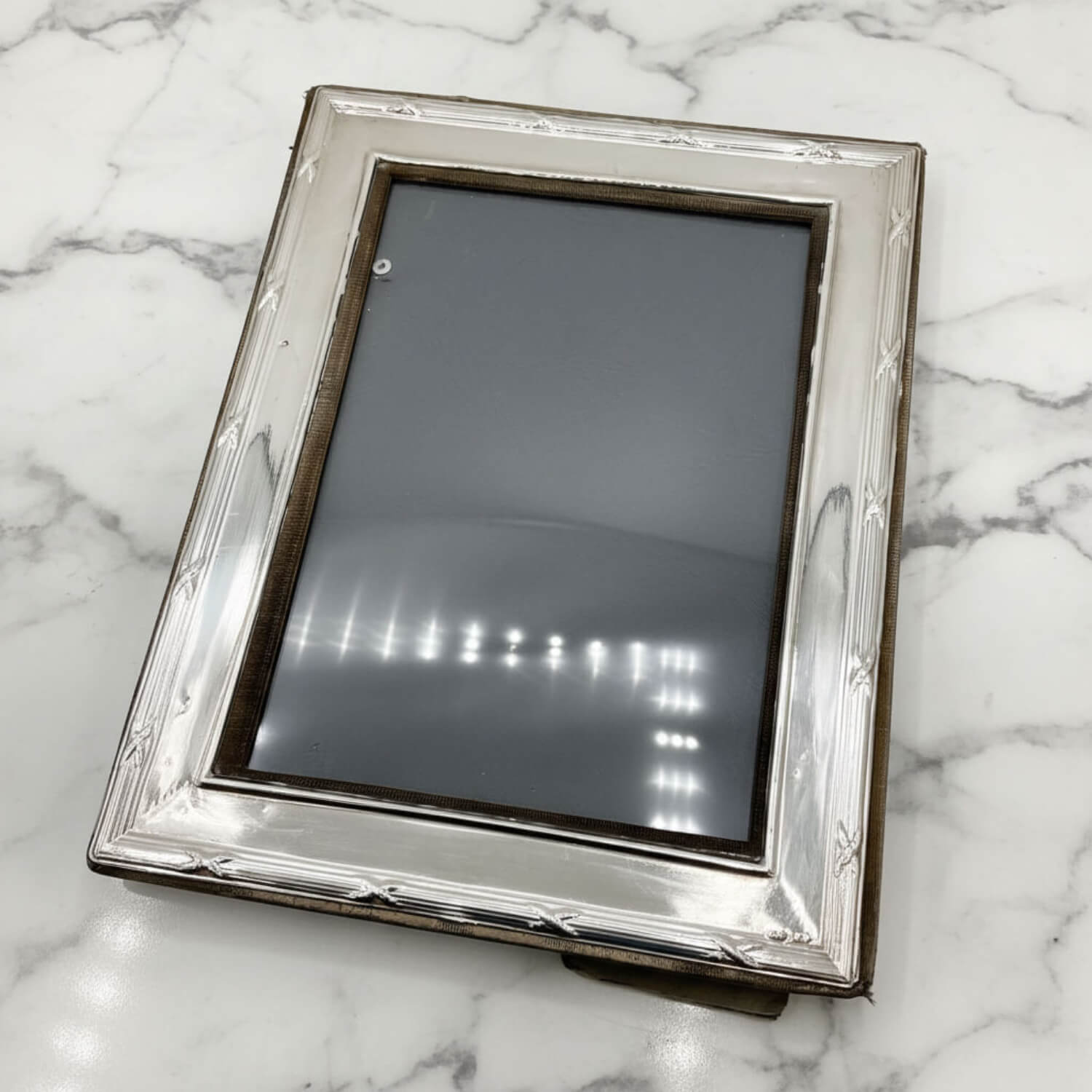 Silver picture frame on a marble surface