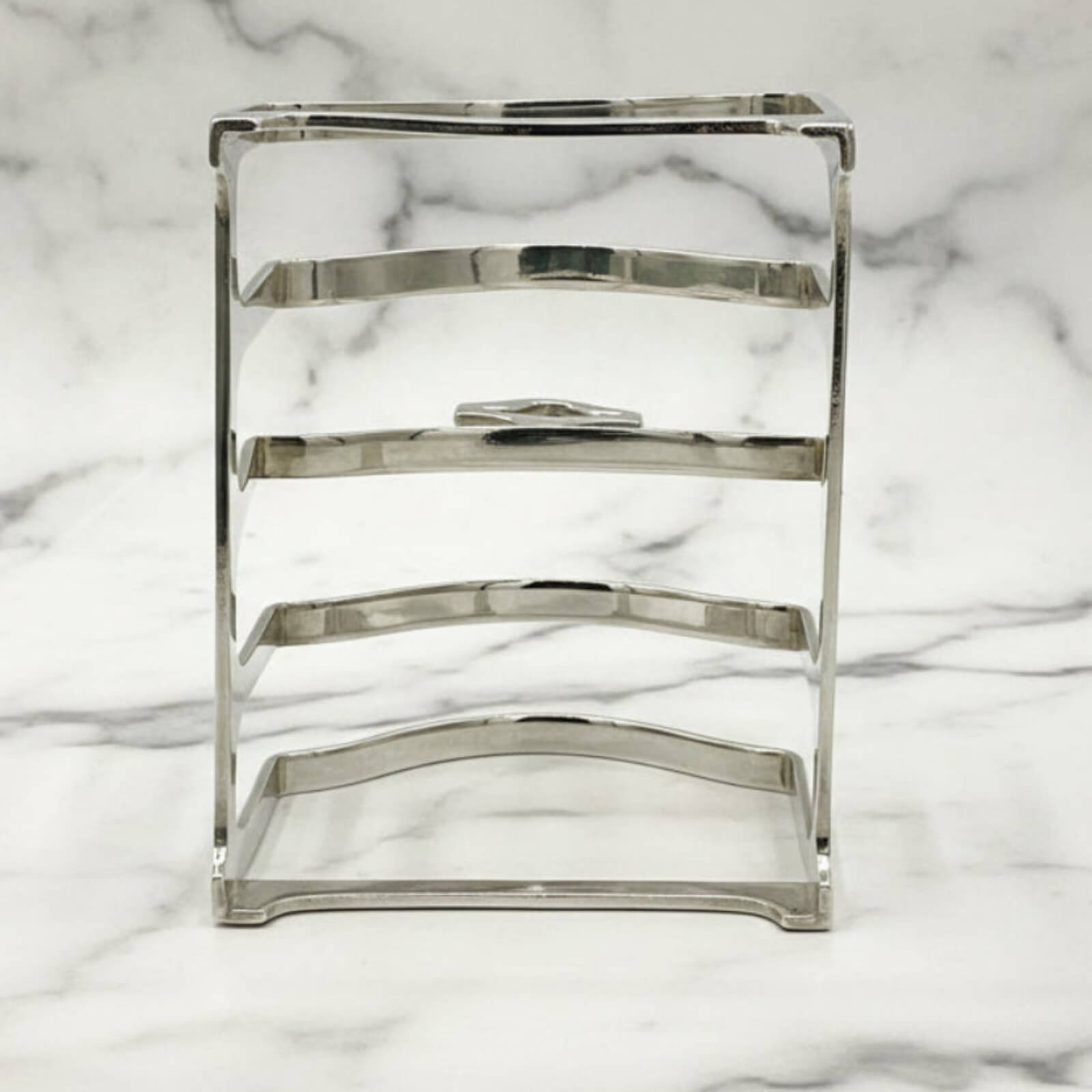 Silver toast rack on a marble background