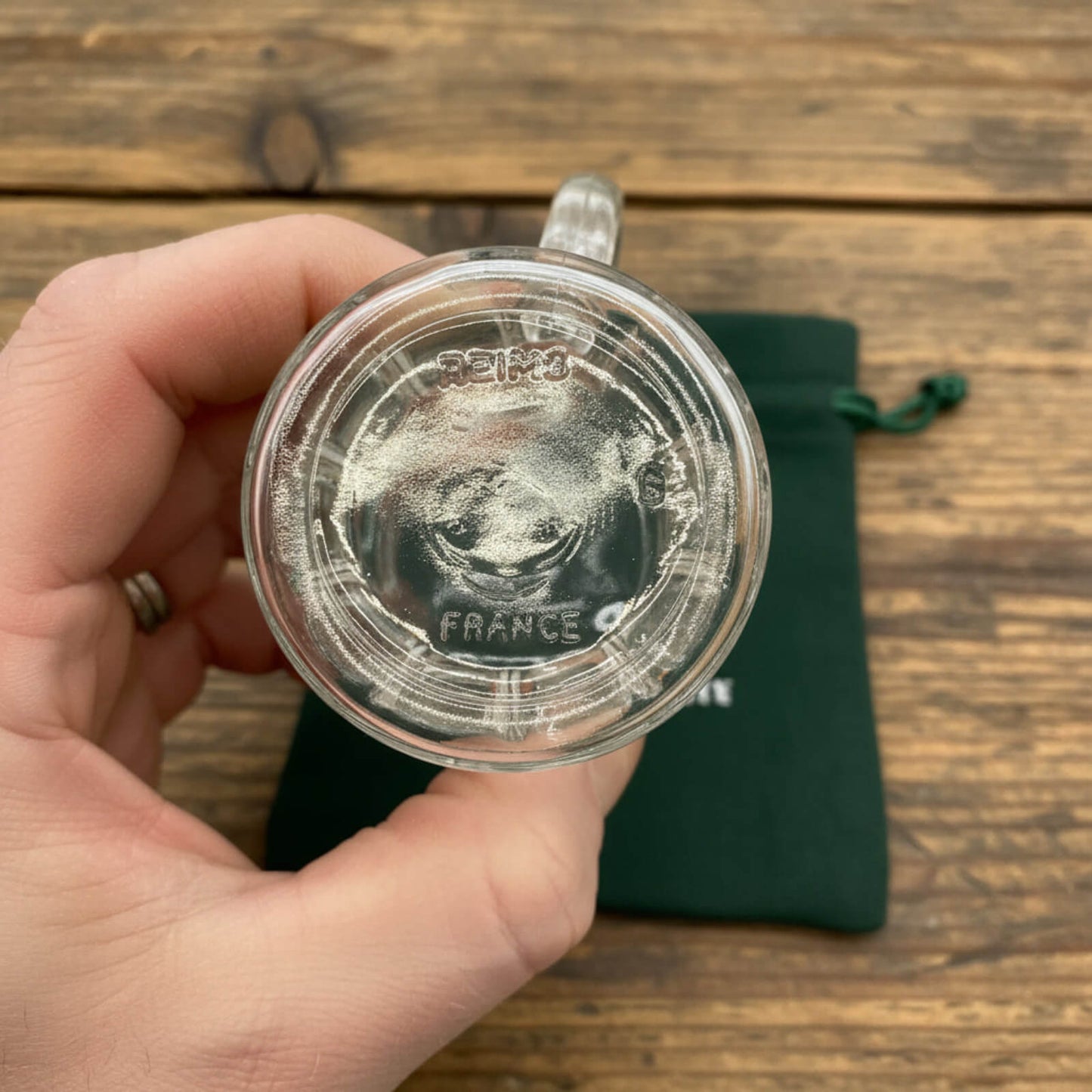 base of glass tankard with a wooden background
