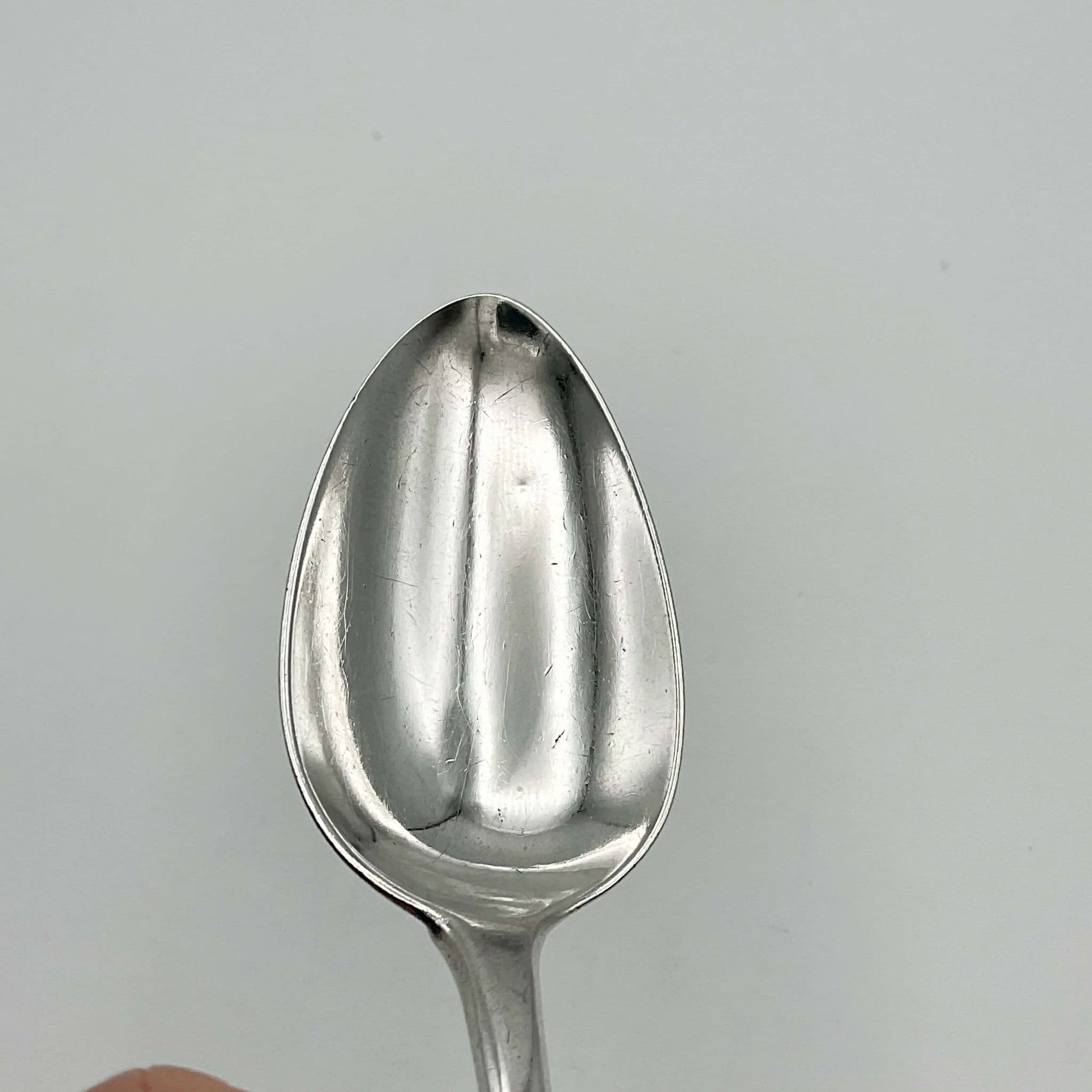 bowl of antique silver dessert spoon