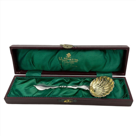 Beautiful gilded Silver sugar sifter spoon in a green lined presentation box