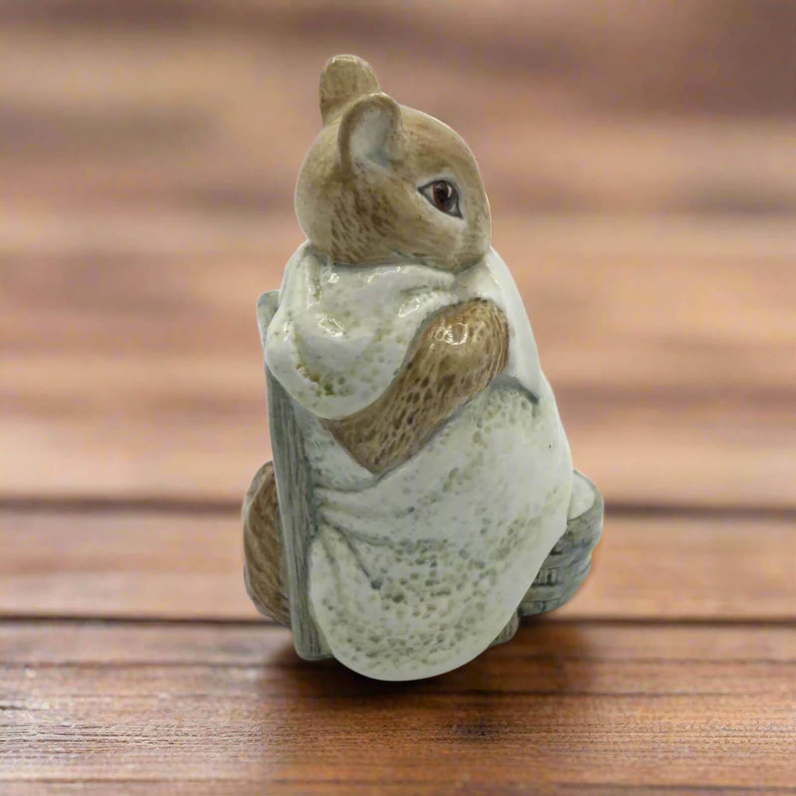 Small figurine of Chippy Hackee on a wooden surface