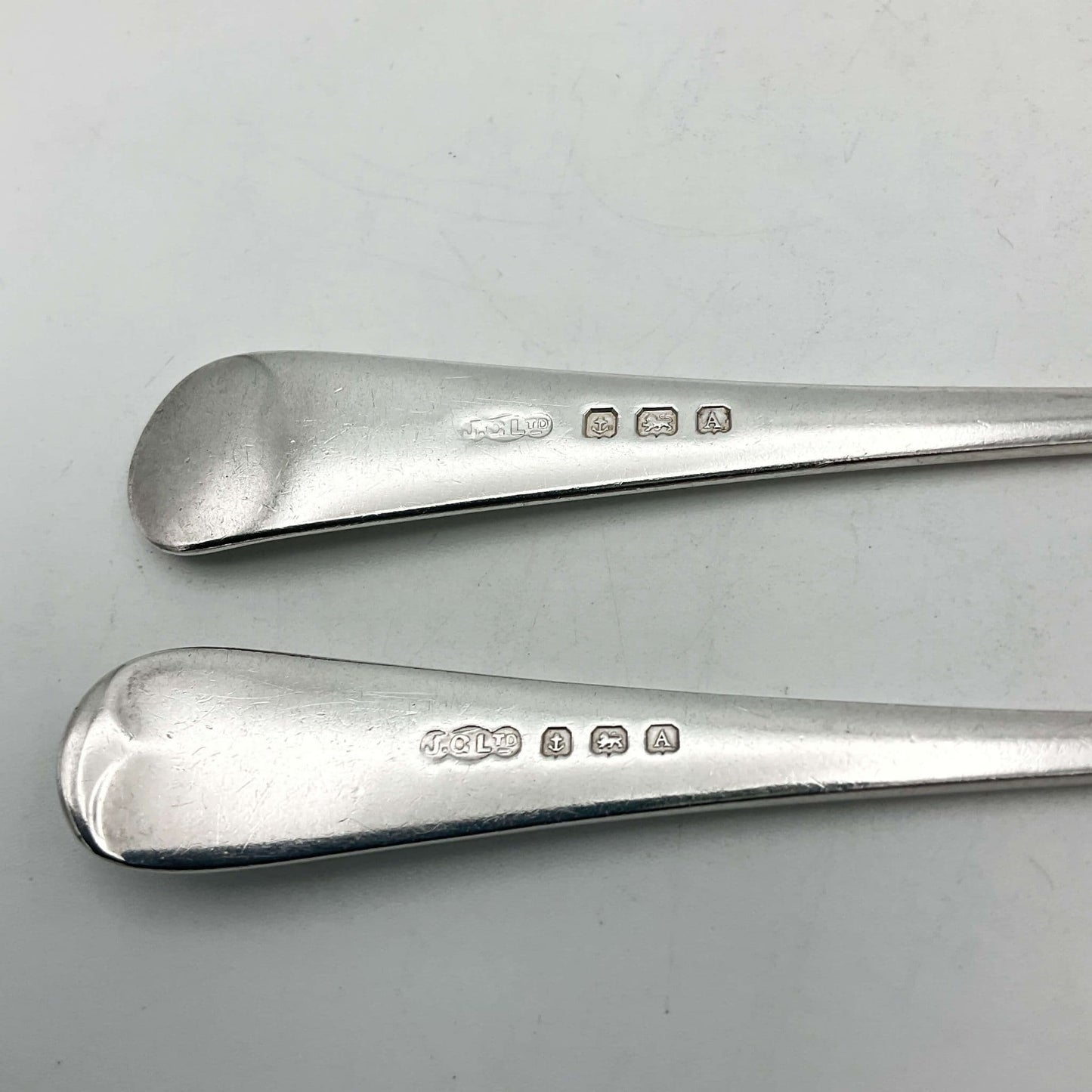 Silver hallmarks on handles of vintage spoon and fork
