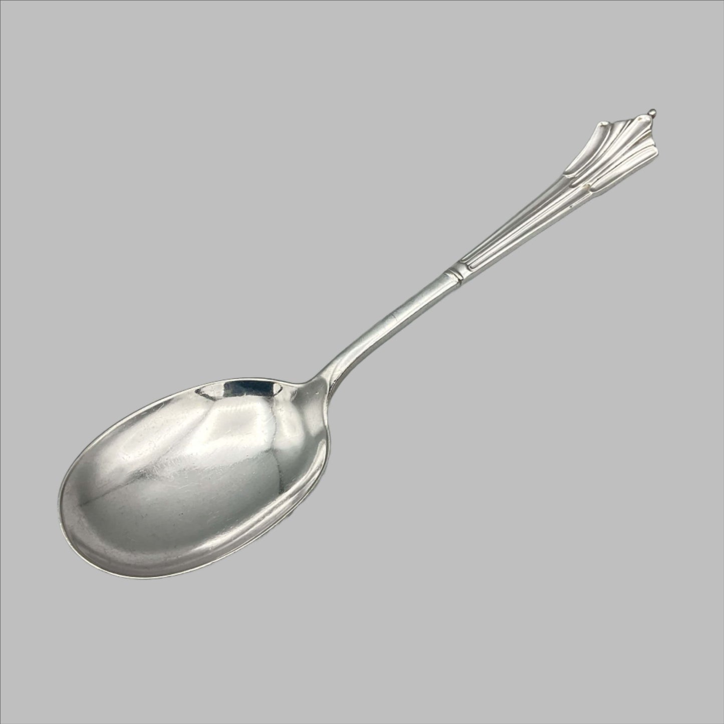 Beautiful 1940s Art Deco Dessert Spoon on a plain background