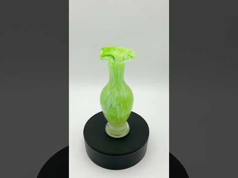 Video short of Green and white Murano glass bud vase from the 1960s on a turntable