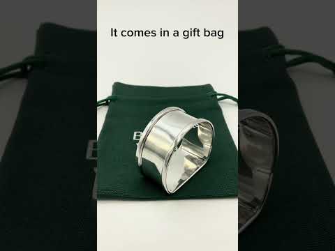 Video showing a Vintage Silver napkin ring on a green gift bag