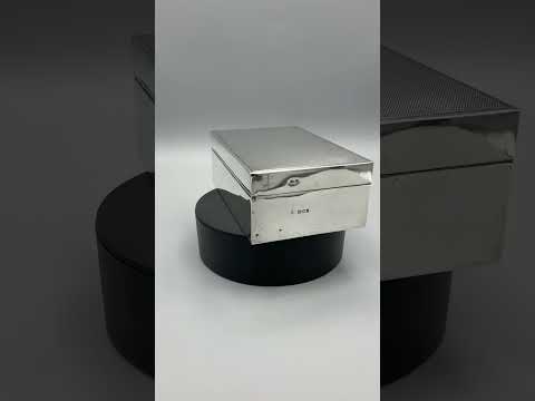 Video short of Vintage 1960s silver cigarette box on a turntable rotating and show it from all angles