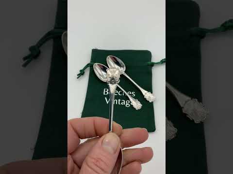 Video short of silver coffee spoons and the gift bag in the background
