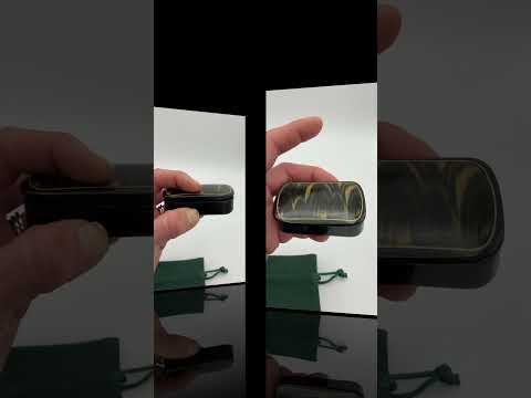 Video short of Antique black lacquer and gold snuff box on a gift bag