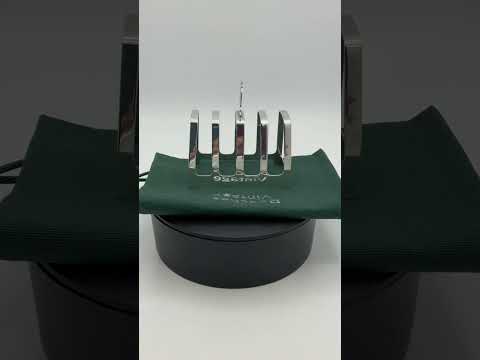Video short of silver toast rack on turntable 
