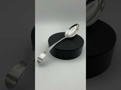 Silver tablespoon on a turntable rotating to see it from all angles
