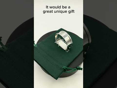 Video of Vintage silver napkin ring on a green gift bag