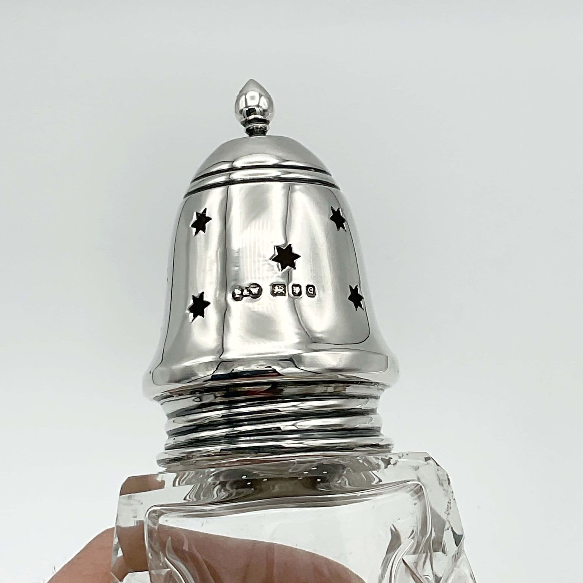Sterling Silver lid of sugar shaker with stars and hallmarks