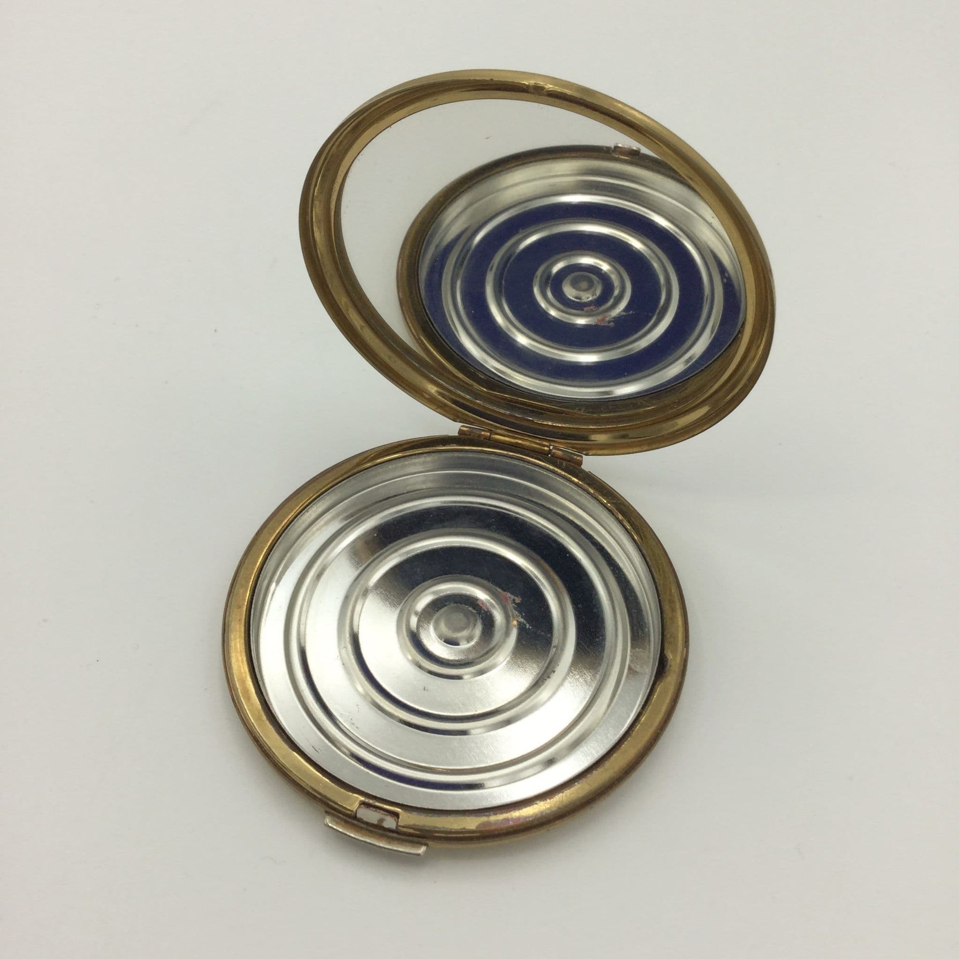 open Stratton compact showing clear mirror and inner base