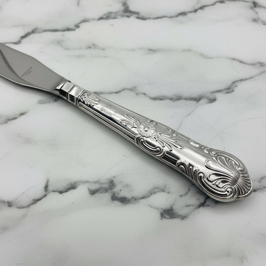 Vintage 1978 Sterling Silver Handled Butter Knife handle on marble