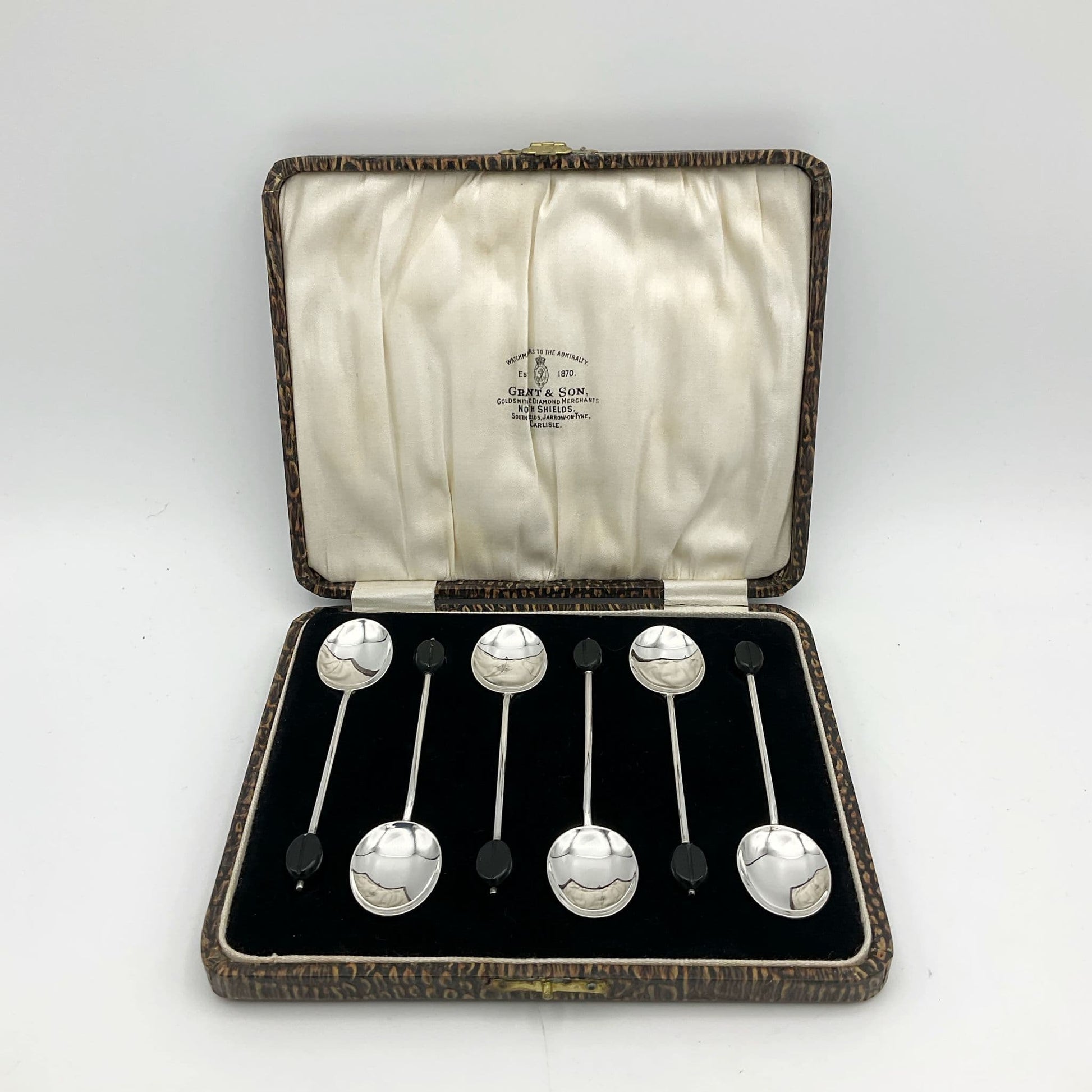 Set of 6 silver coffee spoons in a presentation box with coffee bean shaped ends 