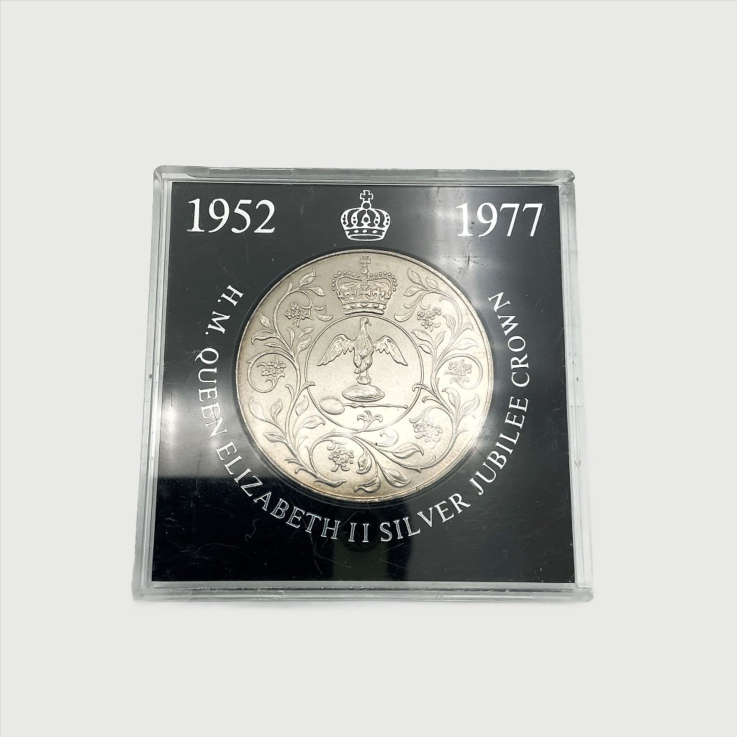 silver crown coin in a black case with HM Queen Elizabeth II Jubliee Crown