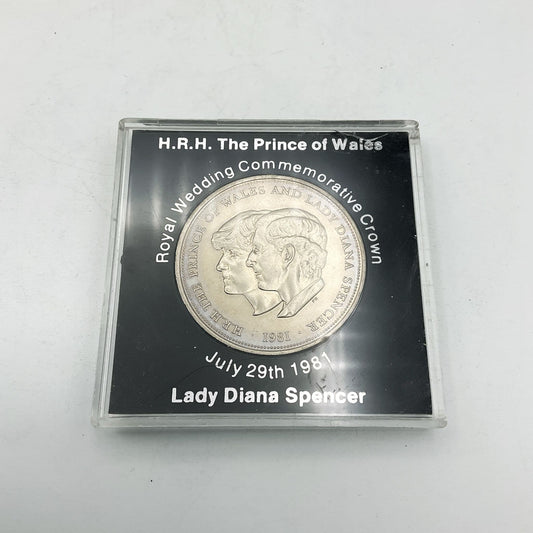 coin with Prince Charles and Lady Diana Spencer in centre in a black case