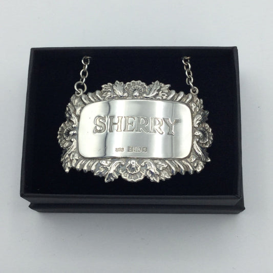 Silver lable with Sherry engraved in the centre in a black box