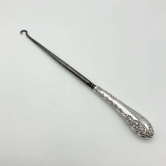Beautiful Silver handled button hook featuring a scroll pattern