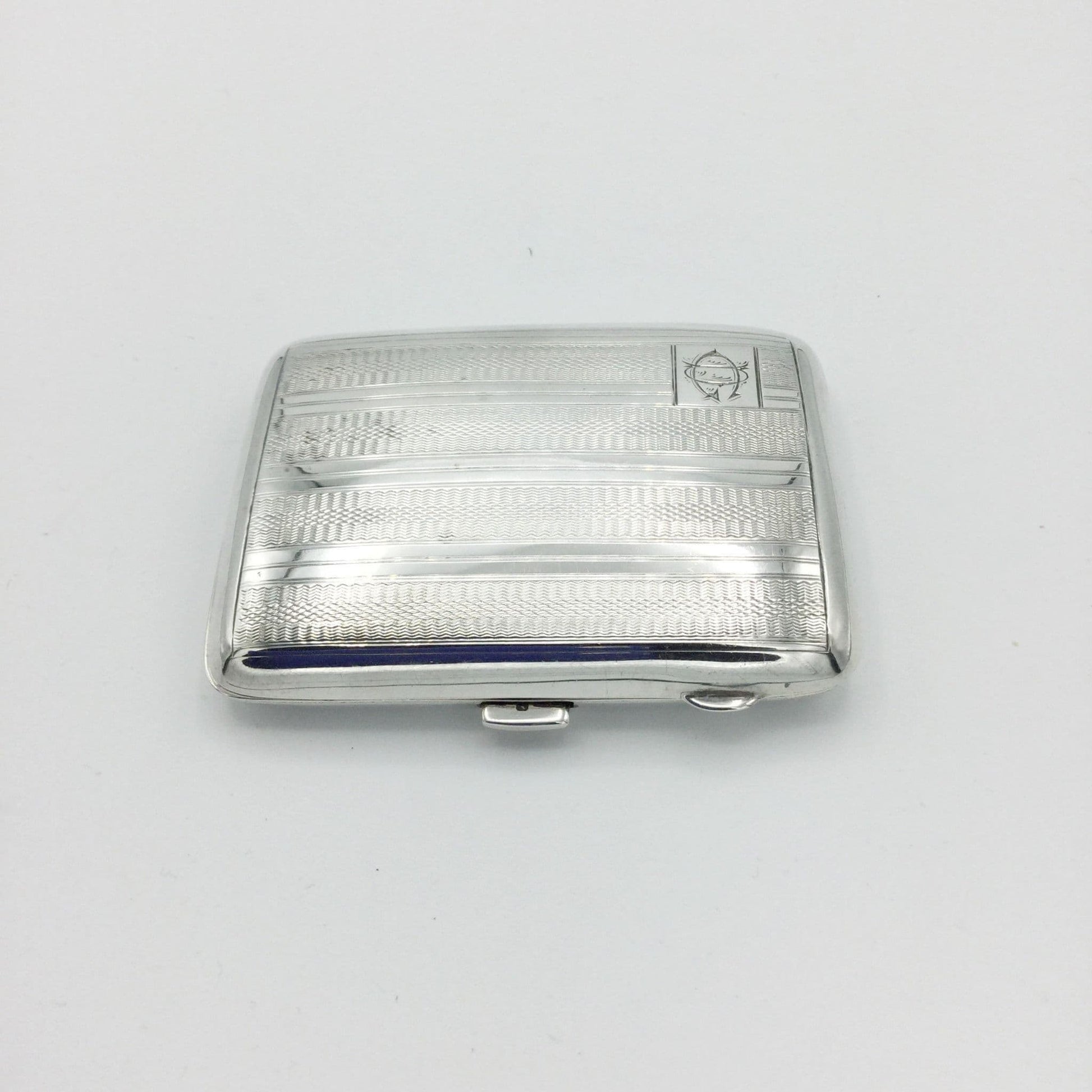 1930s Art Deco Silver cigarette case showing the clasp on a white background